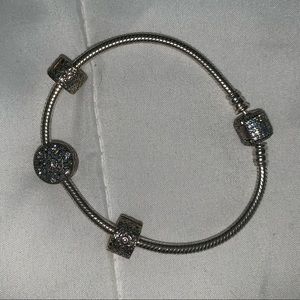 Authentic Pandora charm bracelet with three charms